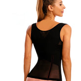 Woman wearing a black compression garment on a white background
